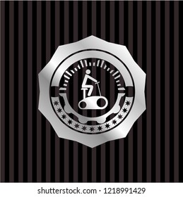 stationary bike icon inside silvery emblem
