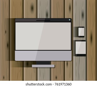 stationary templates with tech devices desktop computer and tablet pc and mobile phone over wooden background