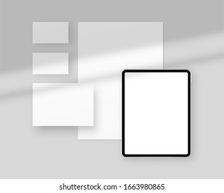 Stationery mockup template with shadow overlays. Vector stationery mockup with papers, business cards, tablet. Branding stationery mockup scene. Corporate identity design.