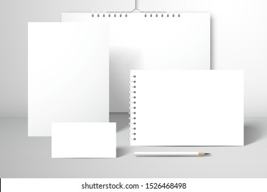 Stationery set for branding. Calendar, album, notebook, business card and pencil. Mockup for design with a shadows