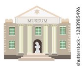 The statue is located in front of the museum.