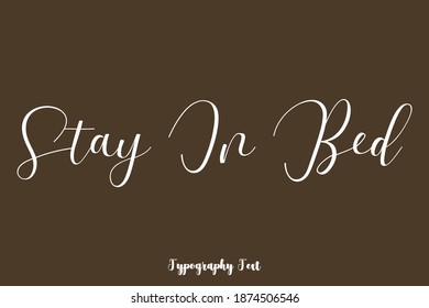 Stay In Bed Cursive Typescript Typography Phrase On Brown Background