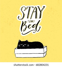 Stay in bed. Funny illustration with black cat sitting in box and hand lettering at yellow background