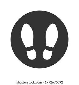 Stay here graphic icon. Shoe prints in the circle sign isolated on white background. Keep your distance. Vector illustration