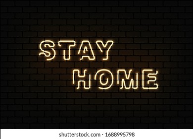 Stay home brightly sign in neon style on dark brick wall . Coronavirus Covid-19 pandemic protection and prevention effort. Social activity message. Quarantine.