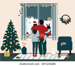 Stay home for Christmas and New year.  Social concept, Covid-19, isolation. The husband, wife and child  stand with their backs to the window and look at the winter landscape.  Vector illustration