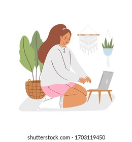 Stay home concept design. Young woman working at home office. Freelance girl with laptop sitting in cozy room. Daily life of freelance worker, online education. Life in quarantine, self-isolation