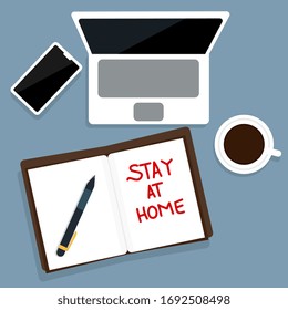 stay at home message with notebook and working equipment