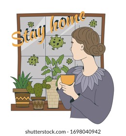 Stay at home to stop spreading pandemic.  Coronavirus prevention: A girl drinks tea near the window