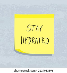 Stay hydrated sign. Yellow sticky note message. Paper sign.