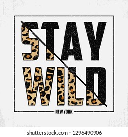 Stay Wild - composite slogan with leopard texture. T-shirt typography print with animal skin. Tee shirt trendy print. Vector illustration.