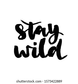 Stay wild - hand drawn lettering phrase isolated on the white background. Fun brush ink inscription for photo overlays, greeting card or t-shirt print, poster design.