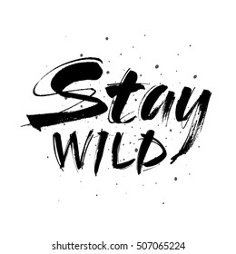 Stay wild hand written lettering for greeting card, tee print, banner, poster. Stay wild quote. Motivational quote. Typography poster. Brush texture. Vector illustration.