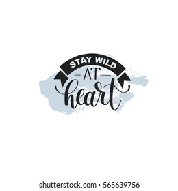 Stay wild at heart handwritten lettering positive quote about life on hipster abstract background, calligraphy vector illustration poster