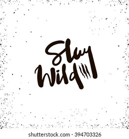 Stay wild inspirational inscription. Hand drawn lettering design. Typography for banner, poster or apparel design. Vector typography.
