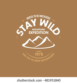 Stay Wild Mountain print for t-shirt or apparel. Old school graphic for fashion and printing. Retro artwork with outdoor theme, elements and typography.  Isolated vector illustration.