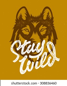 Stay Wild vintage hand made t shirt apparel graphics. Retro print design, distressed stamp effect, custom lettering. Old fashioned motivational wall art home cabin decor. Wolf vector illustration.