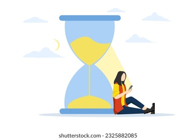 staying up late at night with phone addiction concept, Screen time, rolling doom or wasted time using smartphone, exhausted man sitting with sand glass using smartphone with bright light on his face.