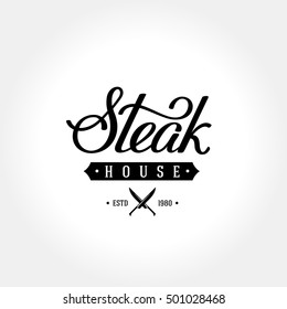Steak house emblem with crossed knives. Handwritten calligraphy. Vector illustration.