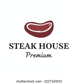 Steak house or fresh meat vintage logo.Premium quality grilled meat.Typography Badge for retro restaurant, bar and cafe.