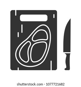 Steak on cutting board with knife glyph icon. Silhouette symbol. Negative space. Vector isolated illustration