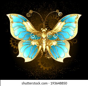 Steampunk mechanical butterfly brass and gold with wings decorated with blue glass and gears.