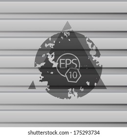 Stencil art composition of a triangle and a circle. with a metallic lamine wall background (the eps10 sample icon is within the mask of the object)