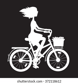 stencil girl in a bicycle with a basket of wild flowers