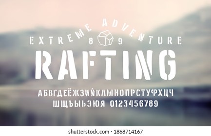 Stencil-plate cyrillic sans serif font in the style of handmade graphic. Letters and numbers for logo and emblem design. White print on blurred background