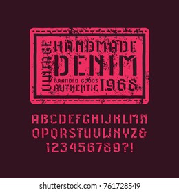Stencil-plate sans serif font in the style of handmade graphics. Denim label and letters with rough texture for t-shirt design. Pink print on black background