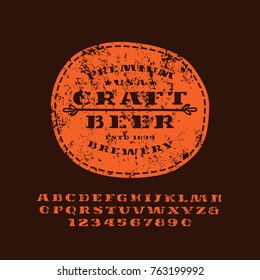 Stencil-plate serif font in the style of handmade graphics. Letters with rough texture. Leather patch with craft beer emblem. Red print on black background