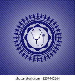 stethoscope icon inside badge with jean texture
