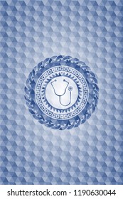 stethoscope icon inside blue badge with geometric pattern background.