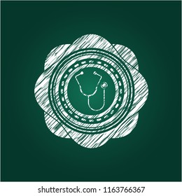 stethoscope icon inside chalkboard emblem written on a blackboard