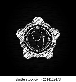 stethoscope icon inside chalkboard emblem written on a blackboard. 