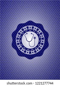 stethoscope icon inside denim background