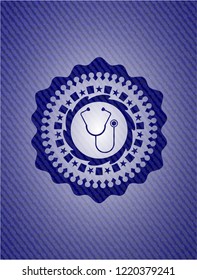 stethoscope icon inside emblem with denim texture