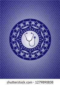 stethoscope icon inside emblem with denim texture