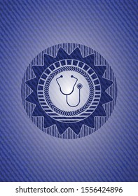 stethoscope icon inside emblem with jean texture