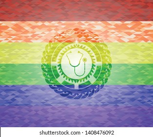 stethoscope icon inside emblem on mosaic background with the colors of the LGBT flag