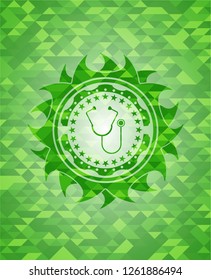 stethoscope icon inside green emblem with triangle mosaic background