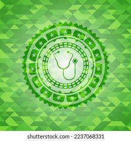 stethoscope icon inside green emblem with mosaic ecological style background. 