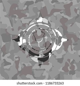 stethoscope icon inside grey camo texture