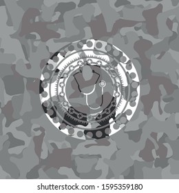 stethoscope icon inside grey camo emblem