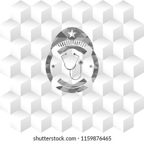 stethoscope icon inside grey emblem with cube white background