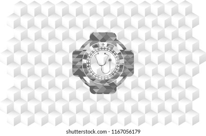 stethoscope icon inside grey emblem with cube white background