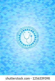 stethoscope icon inside light blue mosaic emblem