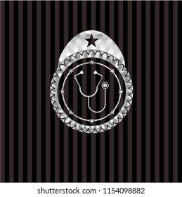stethoscope icon inside silver badge