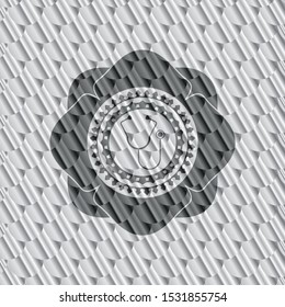 stethoscope icon inside silver badge or emblem. Scales pattern. Vector Illustration. Detailed.