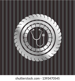 stethoscope icon inside silvery badge or emblem